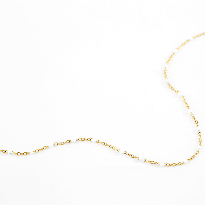 Alba white enamel station necklace flat lay