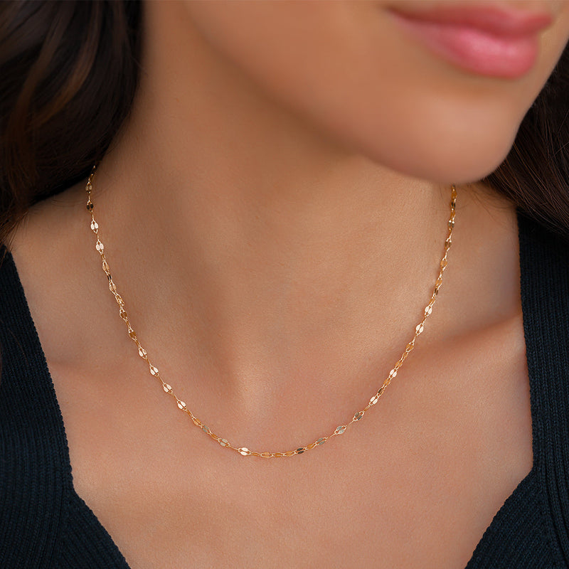 Aurelia gold petal chain necklace worn on model