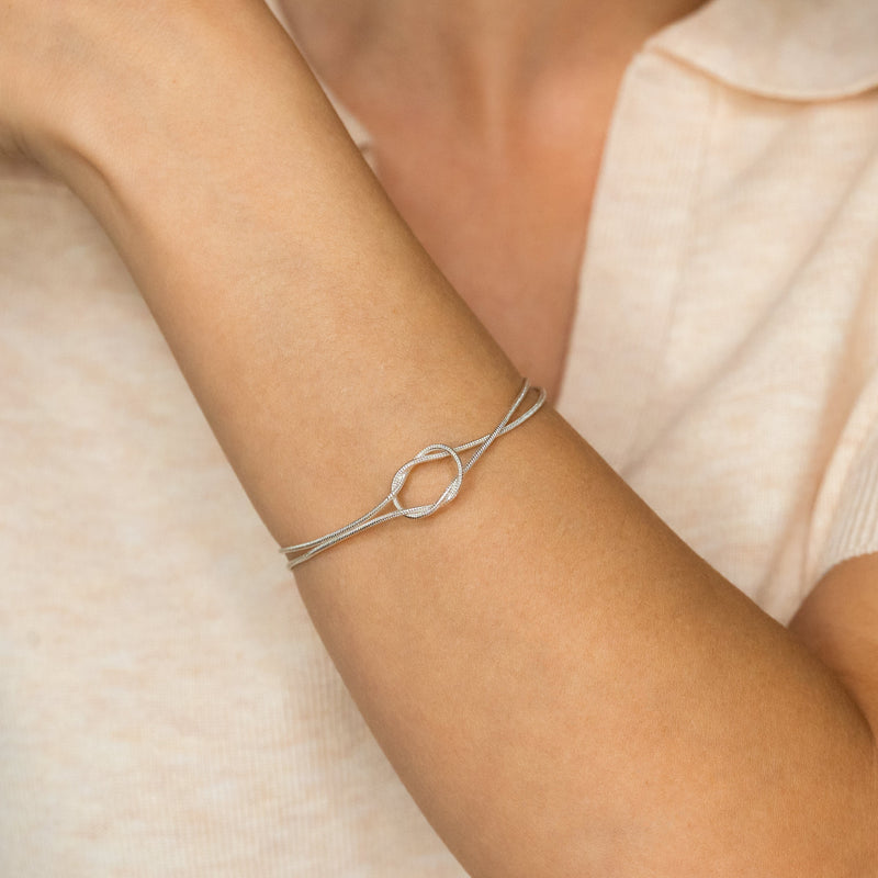 Aurelle silver knot bracelet worn on wrist