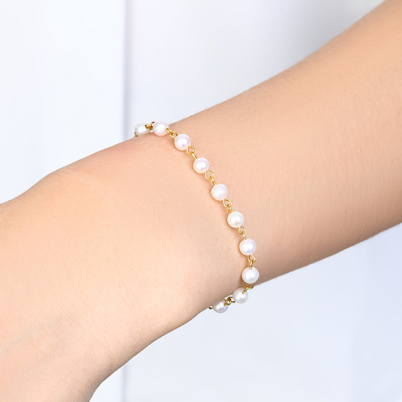 Selene pearl station bracelet worn on wrist