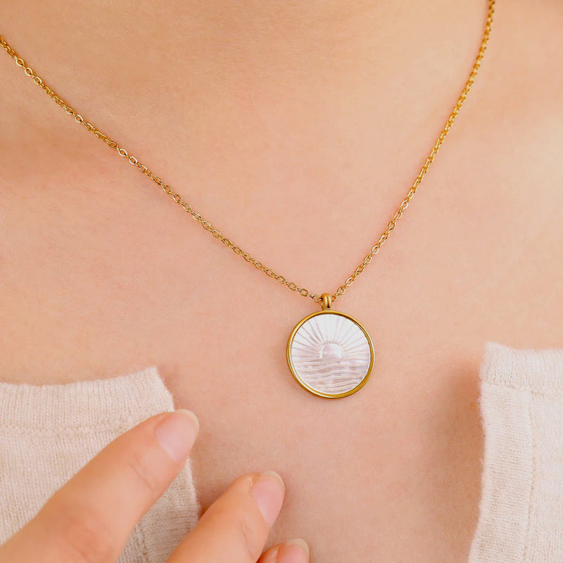 Solene sunrise medallion necklace worn close up