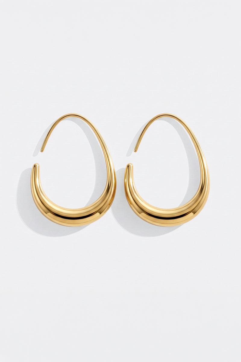 Pair of Solis gold fluid hoop earrings