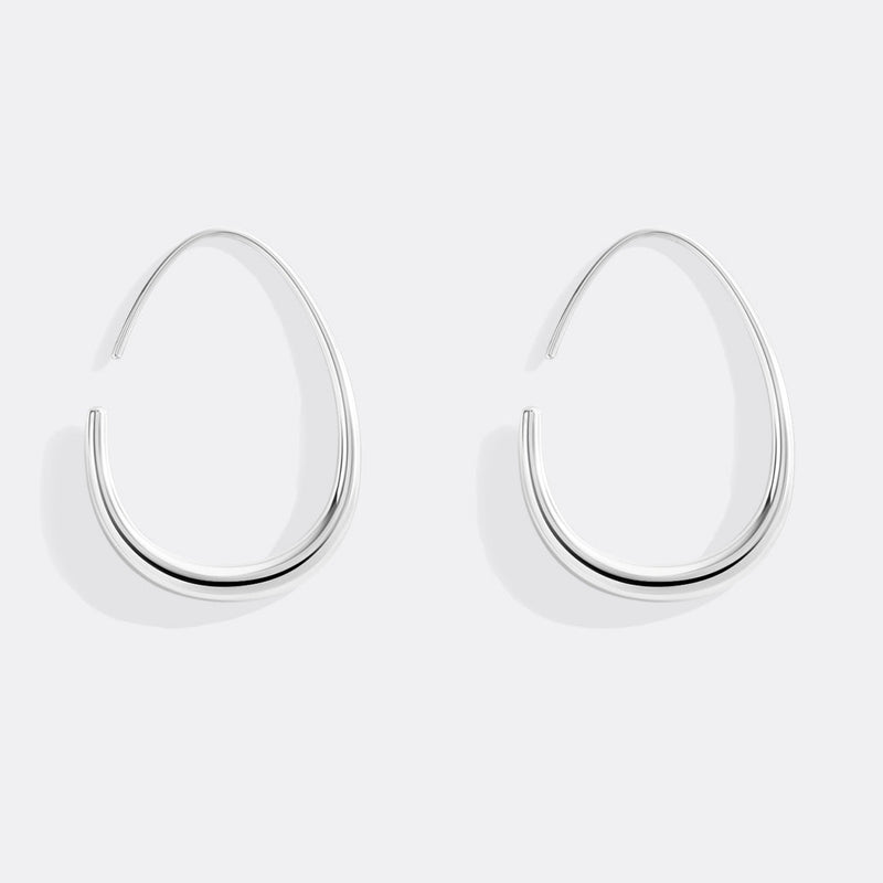 Solis silver fluid hoop earrings front view