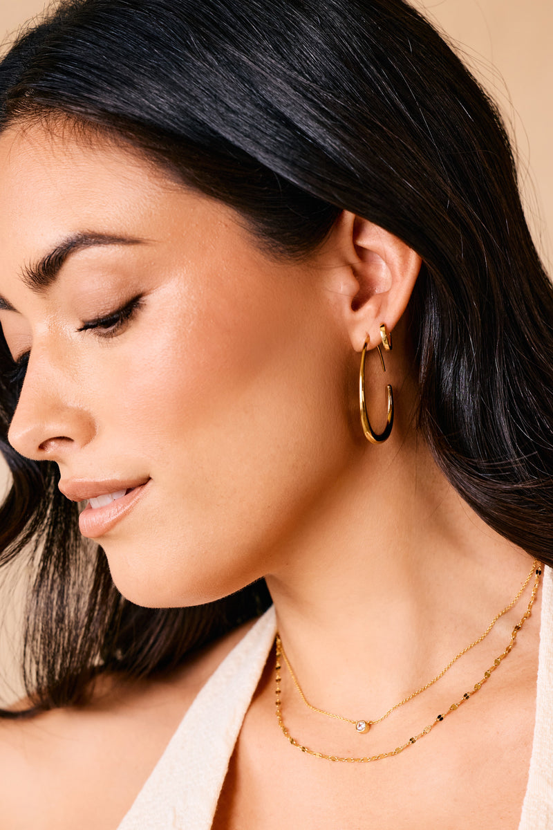 Solis fluid hoop earrings styled