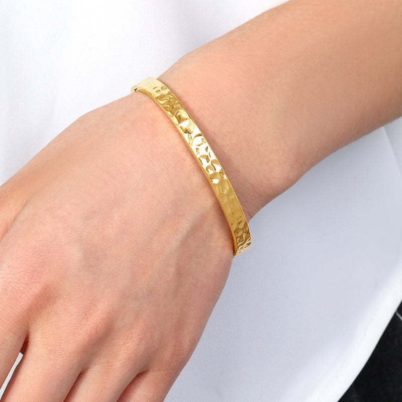 Thalia hammered hinged cuff worn on a wrist