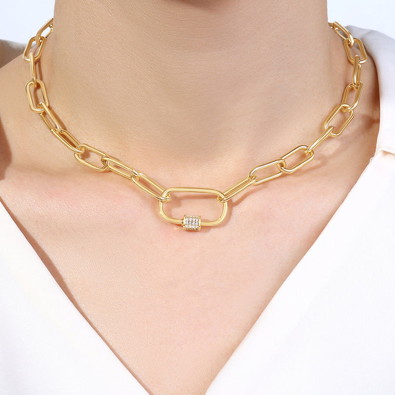 Vela gold-tone carabiner necklace worn on model